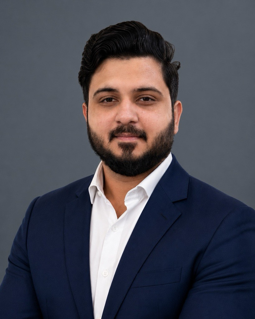 Professional headshot of a Vishtik leadership team member in a navy suit